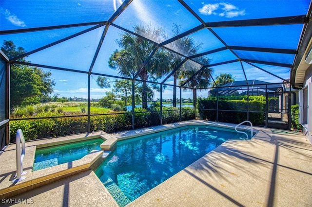 view of swimming pool with a lanai and a patio area