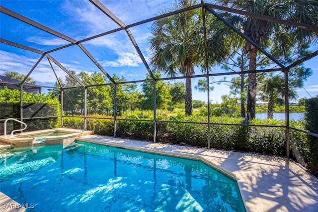 view of pool featuring an in ground hot tub and a lanai