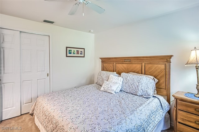 carpeted bedroom with a closet and ceiling fan