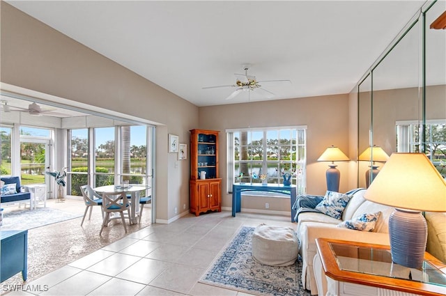 tiled living room featuring ceiling fan