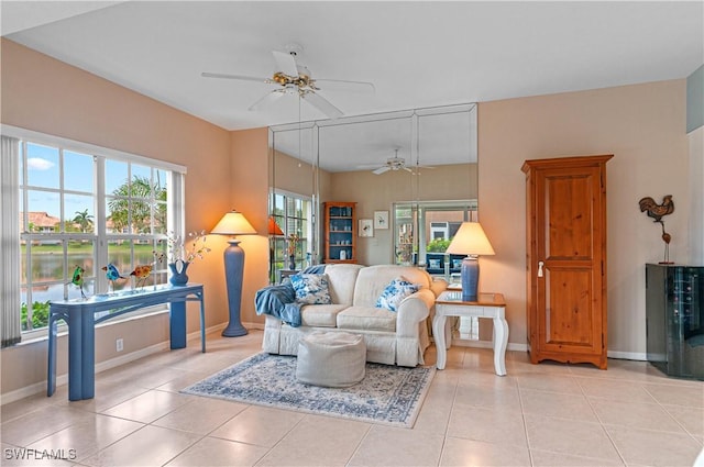 tiled living room with ceiling fan