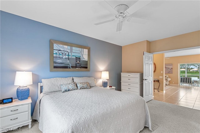 tiled bedroom featuring ceiling fan