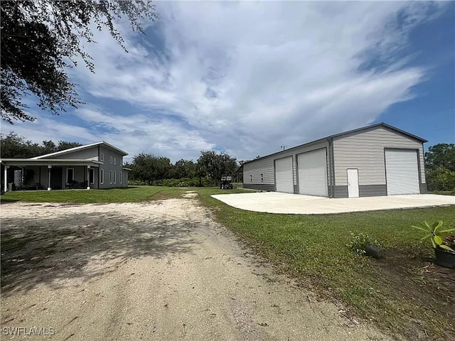 garage featuring a yard