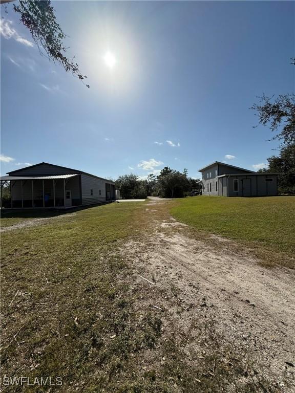 view of yard with a sunroom