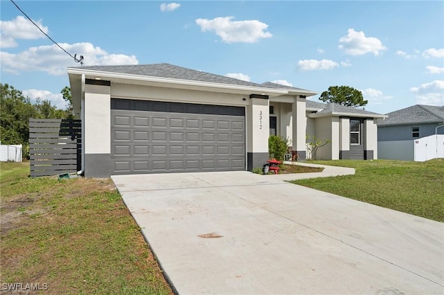 view of front facade with a front yard and a garage