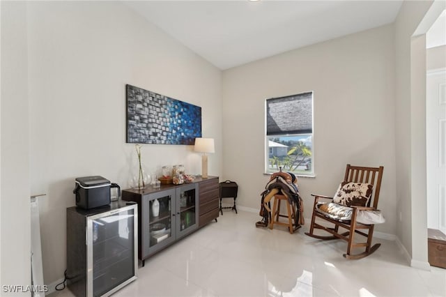 living area with bar area and beverage cooler