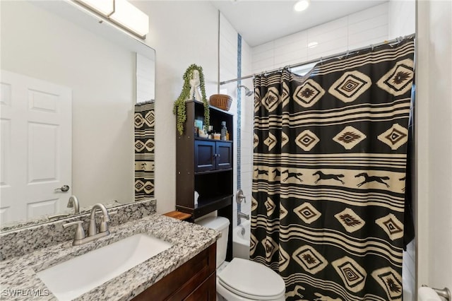 bathroom featuring vanity, toilet, and curtained shower