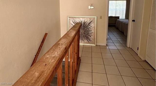 hallway with tile patterned flooring