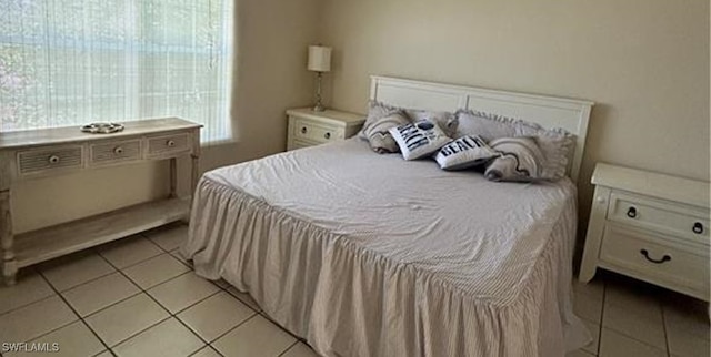 bedroom featuring light tile patterned flooring