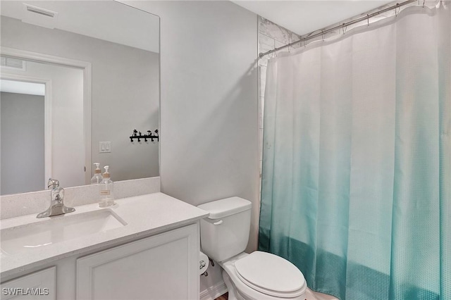 full bathroom featuring vanity, toilet, and shower / tub combo with curtain