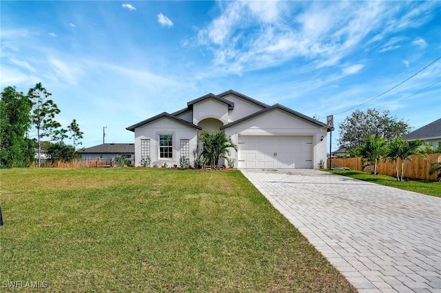 single story home with a garage and a front lawn