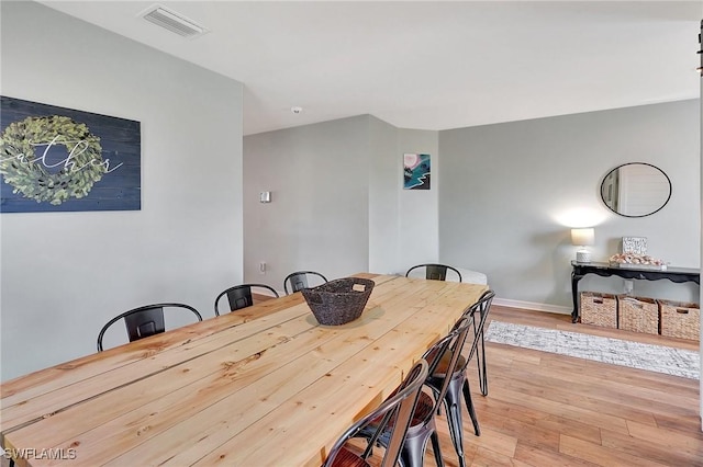 dining space featuring light hardwood / wood-style flooring