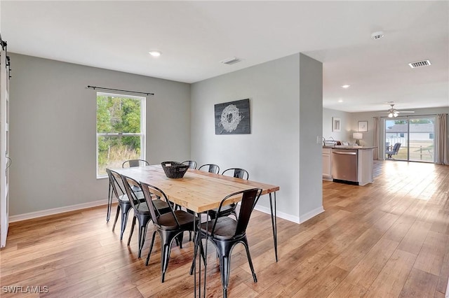 dining area featuring ceiling fan and light hardwood / wood-style floors