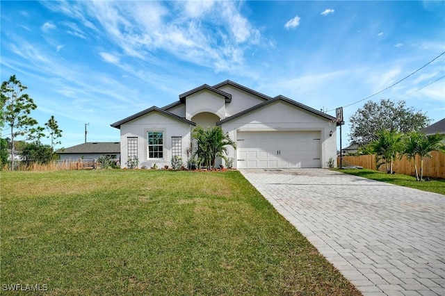 single story home with a front yard and a garage