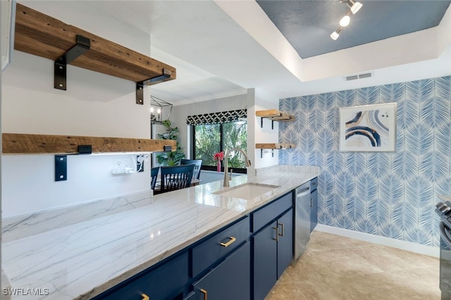 kitchen with dishwasher, sink, light stone countertops, blue cabinetry, and ornamental molding