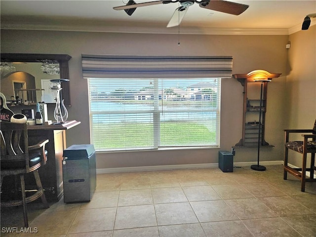 interior space featuring a wealth of natural light, ornamental molding, and light tile patterned flooring