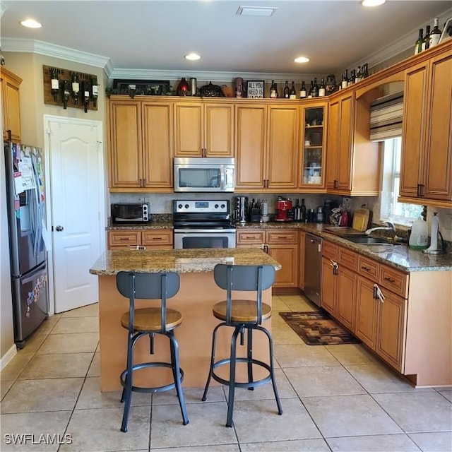 2851 Via Campania St, Fort Myers, FL 33905 - kitchen with a sink, appliances with stainless steel finishes, crown molding, and light stone counters