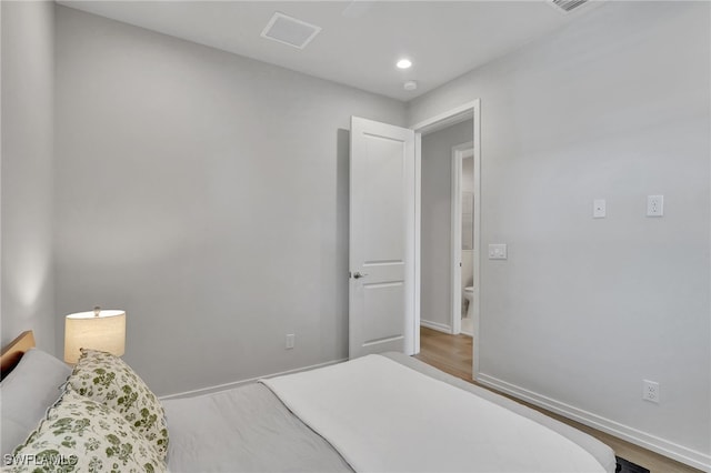 bedroom featuring wood-type flooring