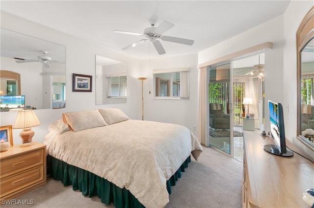 bedroom featuring light carpet, access to outside, and ceiling fan