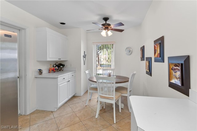 tiled dining room with ceiling fan