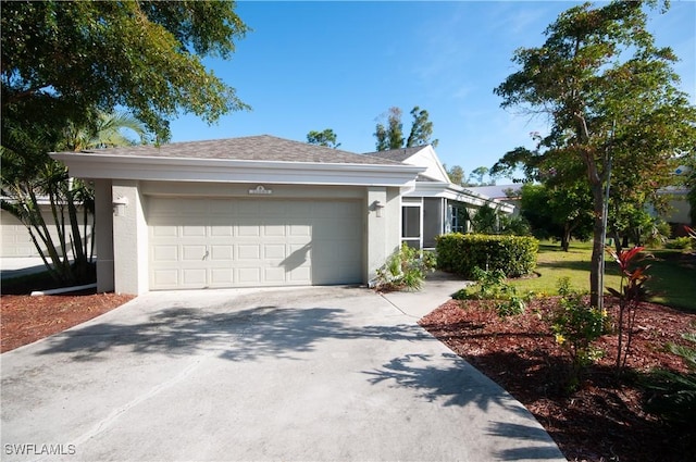 view of side of property featuring a lawn and a garage