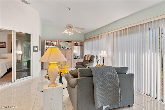 tiled living room featuring ceiling fan