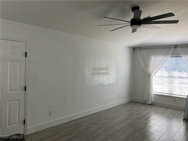 empty room featuring hardwood / wood-style flooring and ceiling fan