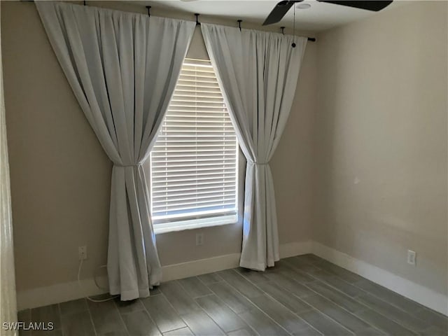 spare room with ceiling fan