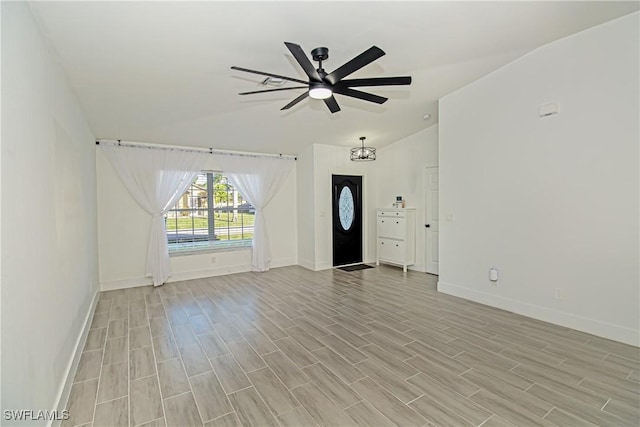 unfurnished living room featuring ceiling fan, lofted ceiling, and light wood-type flooring