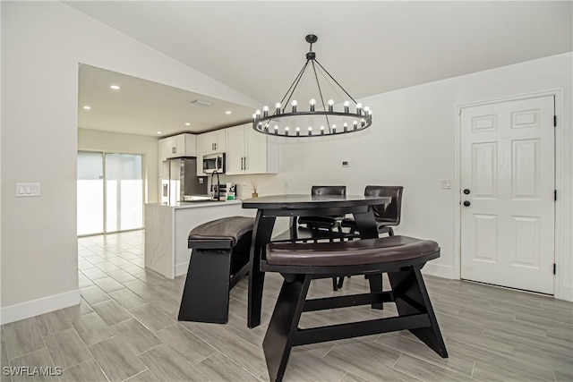 dining room with lofted ceiling