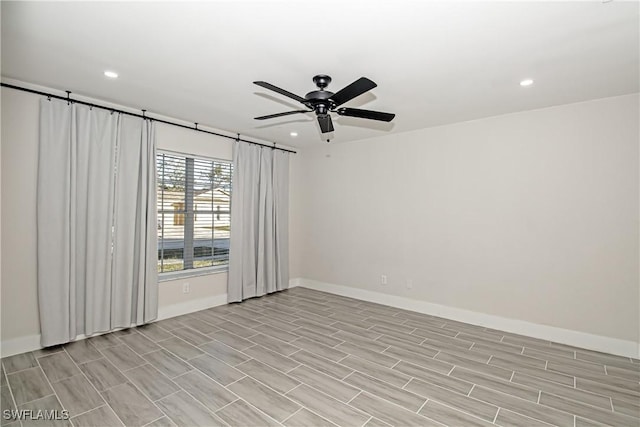 spare room with ceiling fan