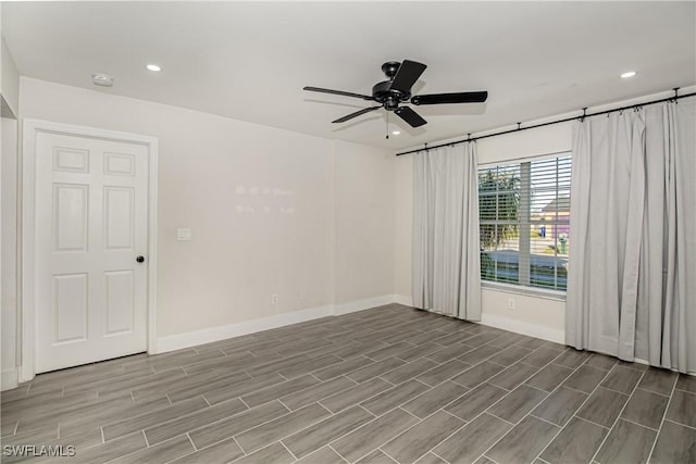 spare room with ceiling fan