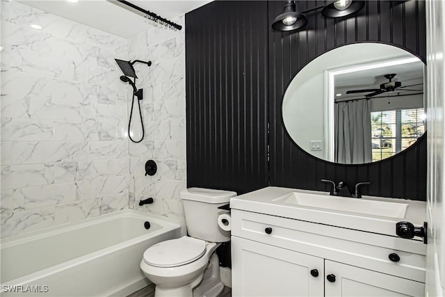 full bathroom with vanity, ceiling fan, tiled shower / bath combo, and toilet