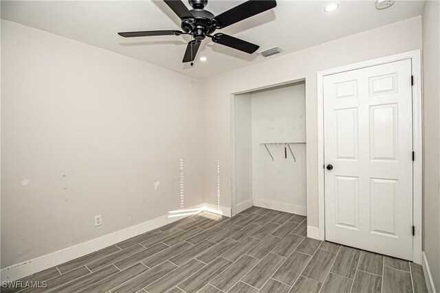 unfurnished bedroom featuring a closet and ceiling fan