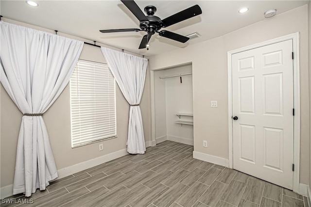 unfurnished bedroom featuring a closet and ceiling fan