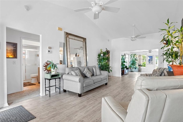 living room featuring light hardwood / wood-style flooring and vaulted ceiling