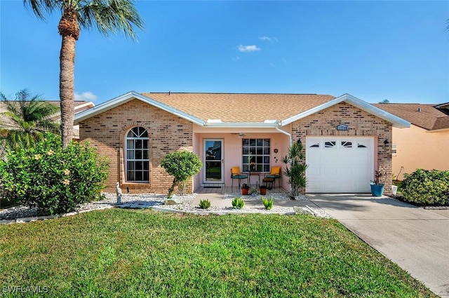 single story home featuring a front yard and a garage