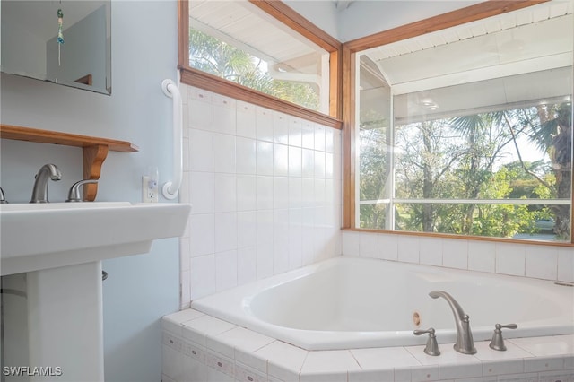 bathroom with tiled bath