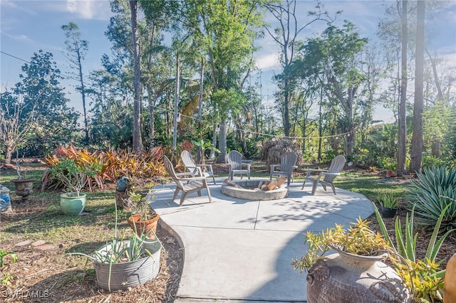 view of patio / terrace with an outdoor fire pit