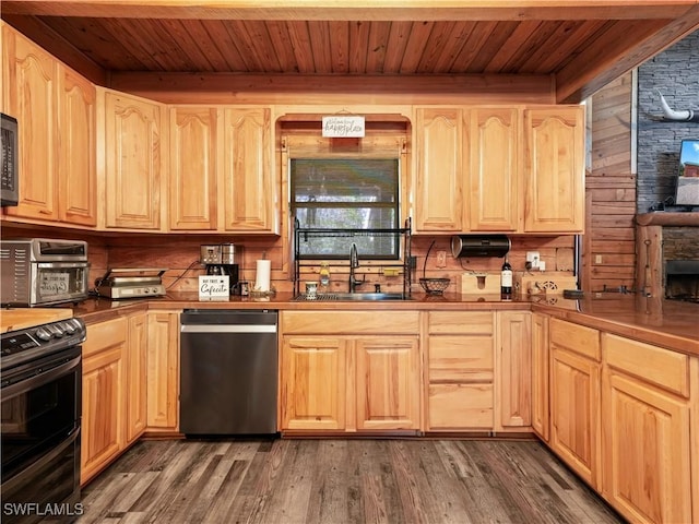 kitchen with light brown cabinetry, dark wood-type flooring, sink, and black appliances