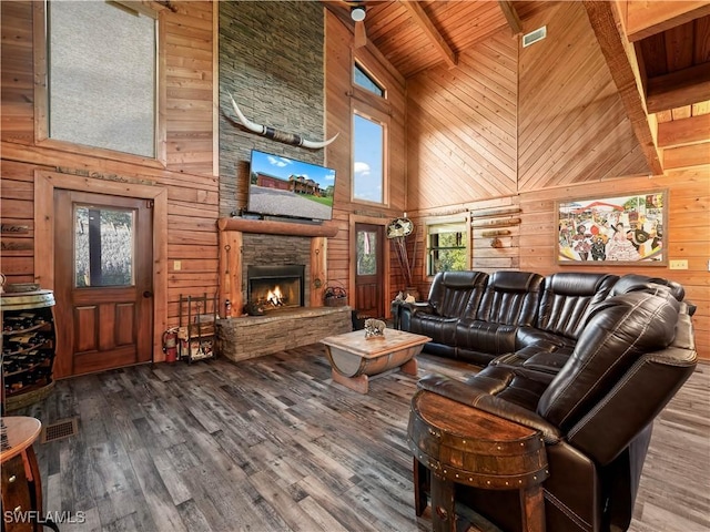 living room with wood ceiling, wooden walls, beam ceiling, high vaulted ceiling, and hardwood / wood-style floors