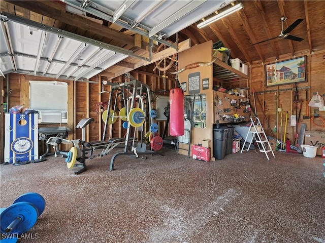 garage featuring a workshop area and ceiling fan