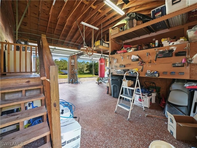 misc room with a workshop area and vaulted ceiling