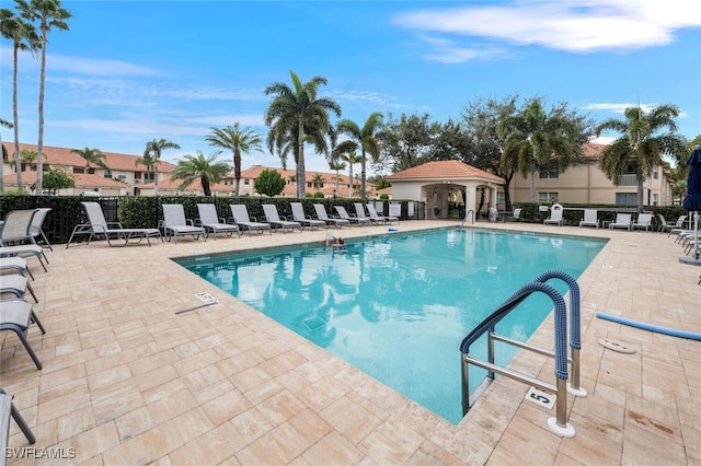 view of swimming pool featuring a patio area