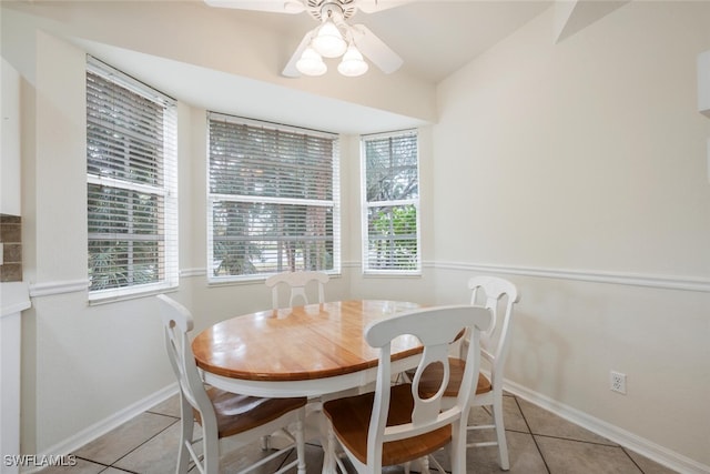 tiled dining area with ceiling fan