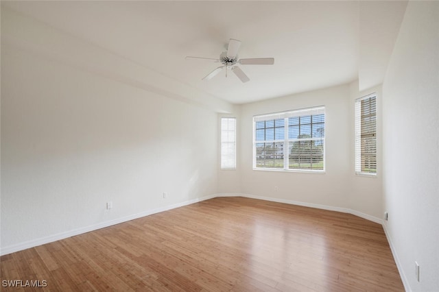 spare room featuring light hardwood / wood-style floors and ceiling fan