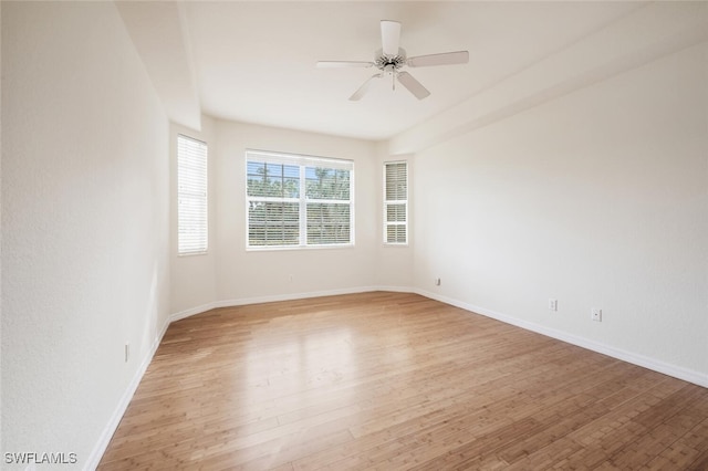 unfurnished room with ceiling fan and light hardwood / wood-style flooring