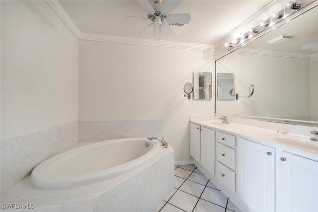 bathroom with tiled tub, crown molding, tile patterned flooring, and vanity