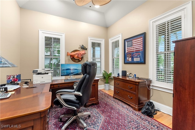 office with ceiling fan, wood-type flooring, and lofted ceiling