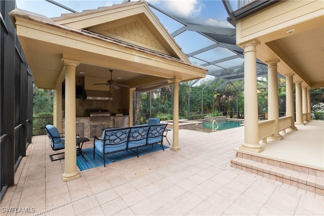 view of patio featuring an outdoor living space, ceiling fan, a lanai, a grill, and exterior kitchen